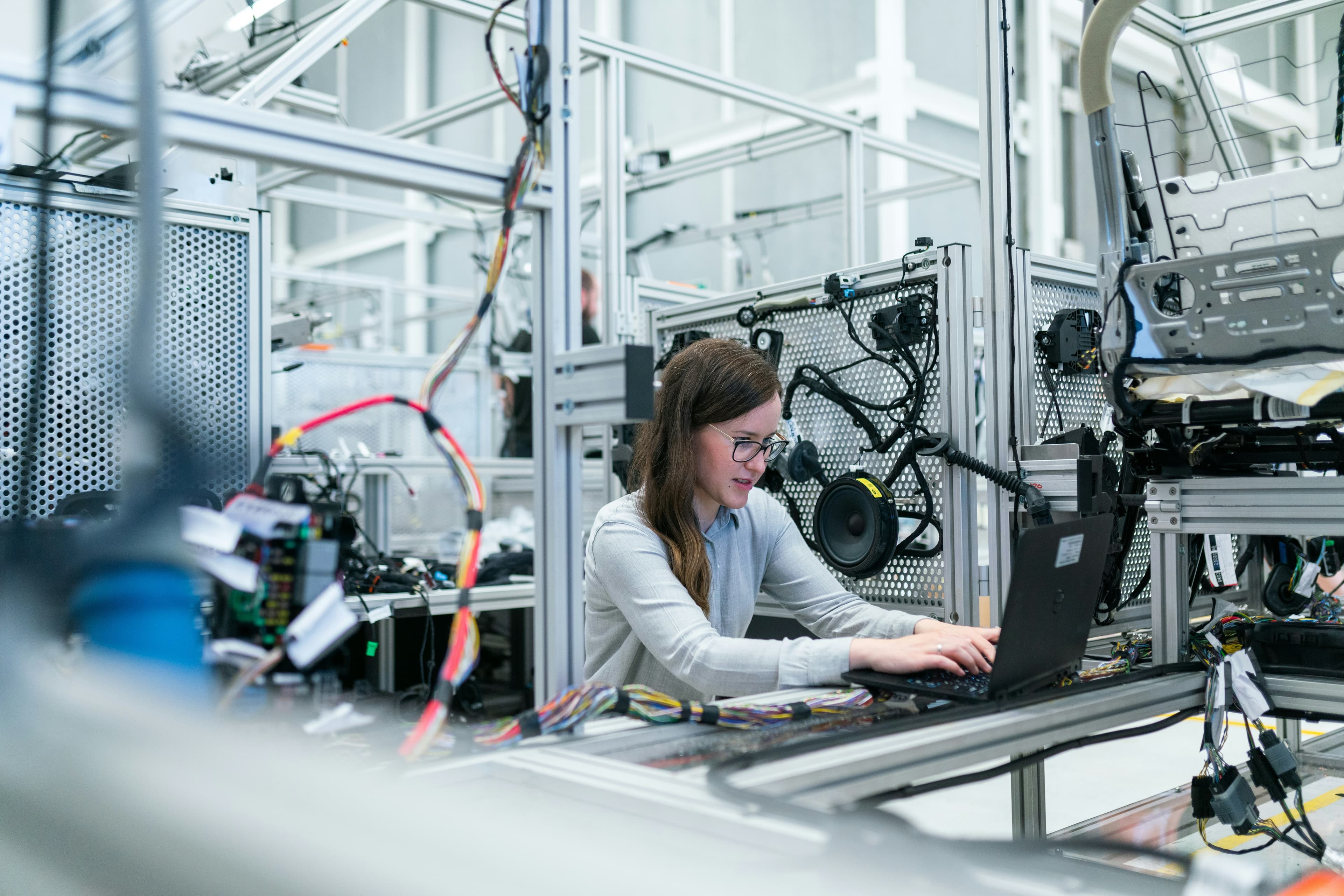 Engineer testing connected hardware